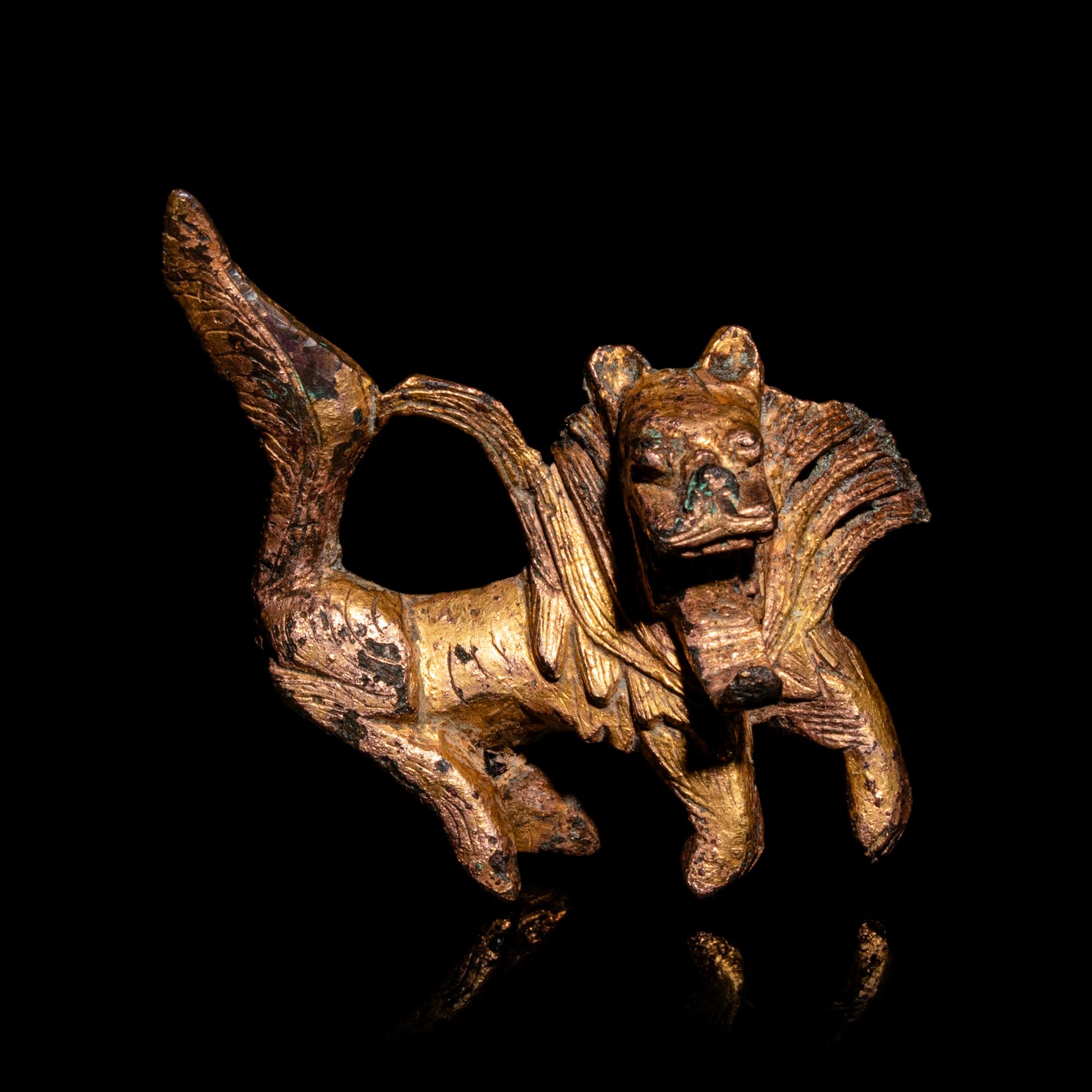 A Small Chinese Gilt Bronze Fu Lion-Form Decoration, Jin-Northern and Southern Dynasties 晉-南北朝 銅鎏金佛獅飾件