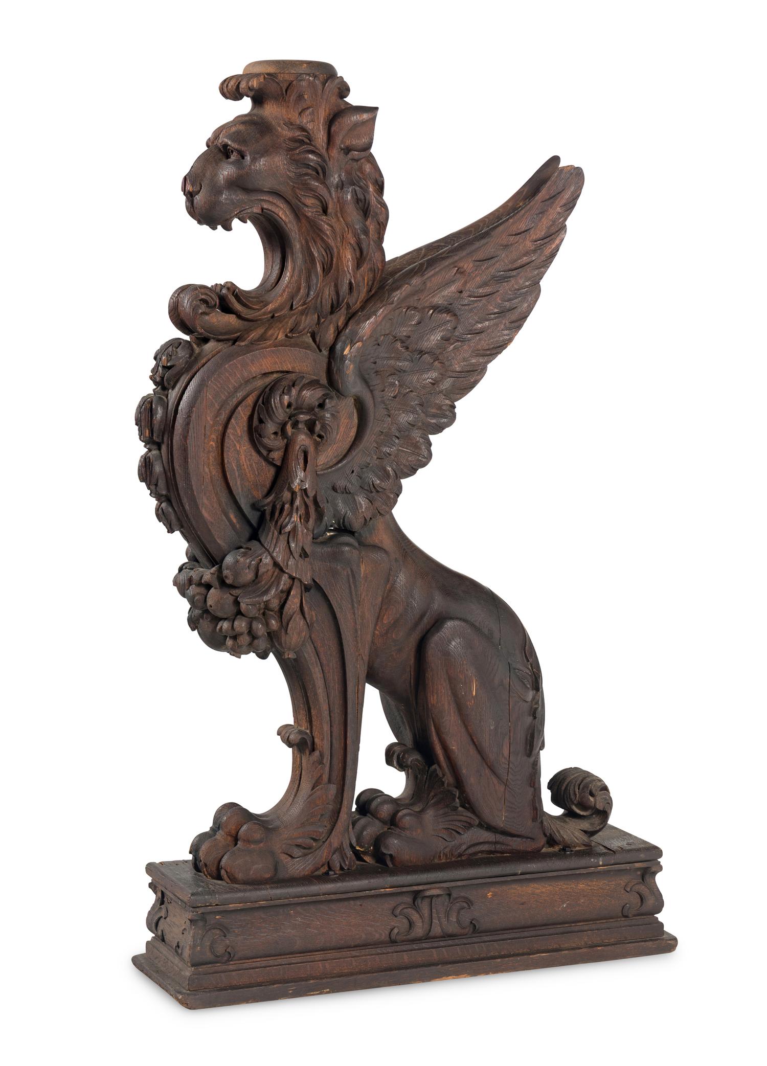 A Massive Carved Oak Griffin Newel Post