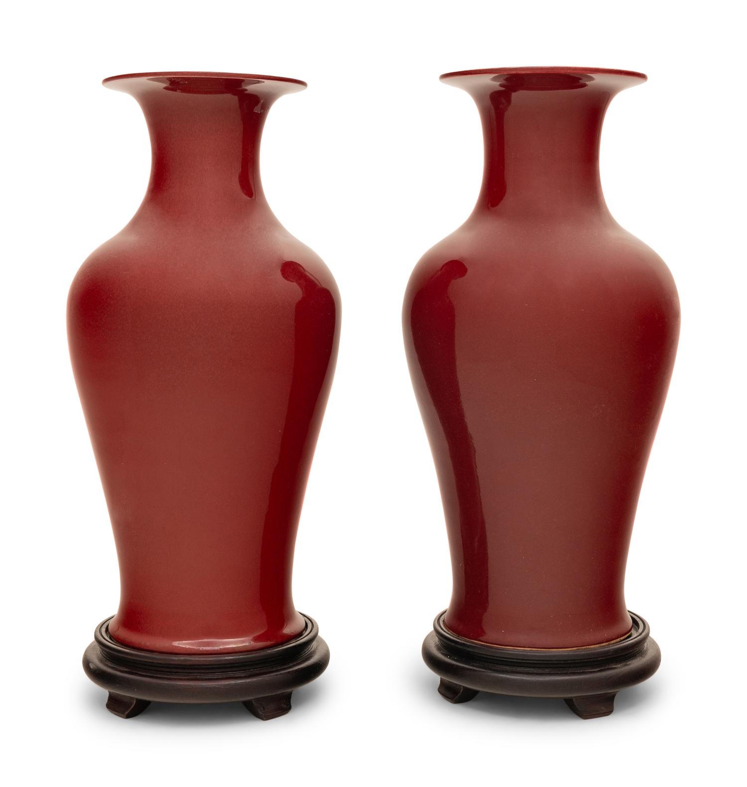 A Pair of Chinese Red Glazed Vases on Stands