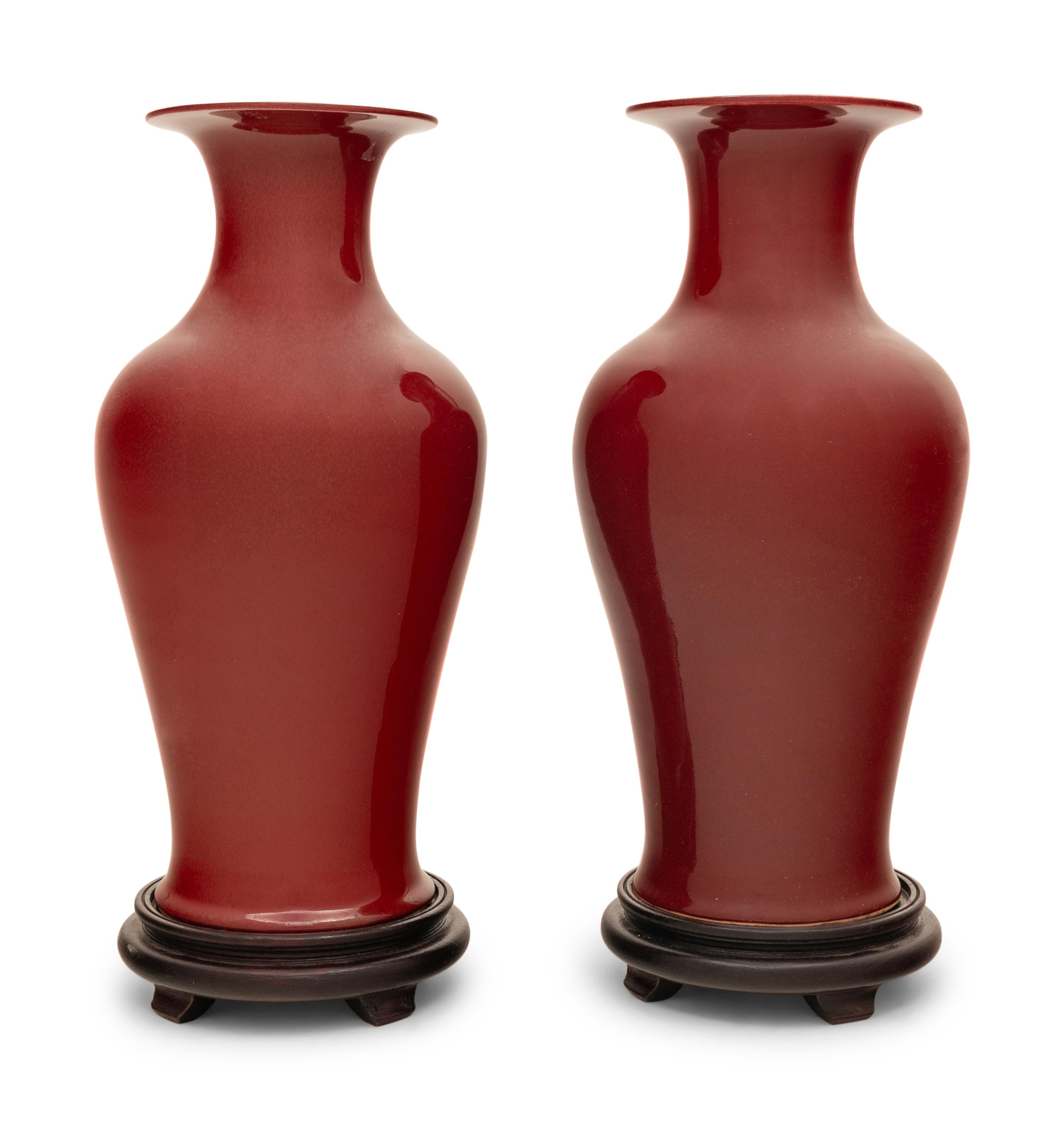 A Pair of Chinese Red Glazed Vases on Stands