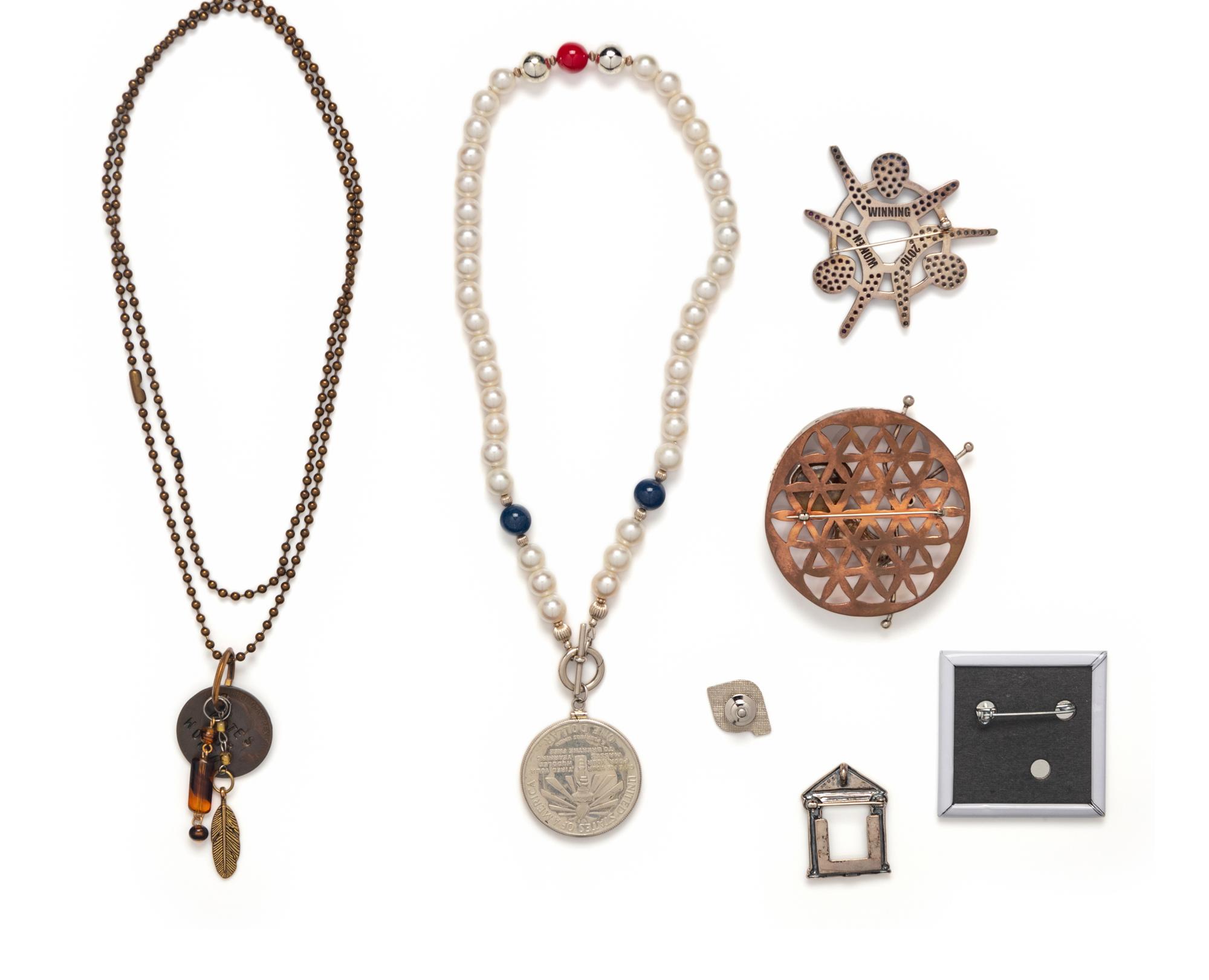 COLLECTION OF SEVEN PATRIOTIC AND FEMINISM THEMED JEWELRY ITEMS