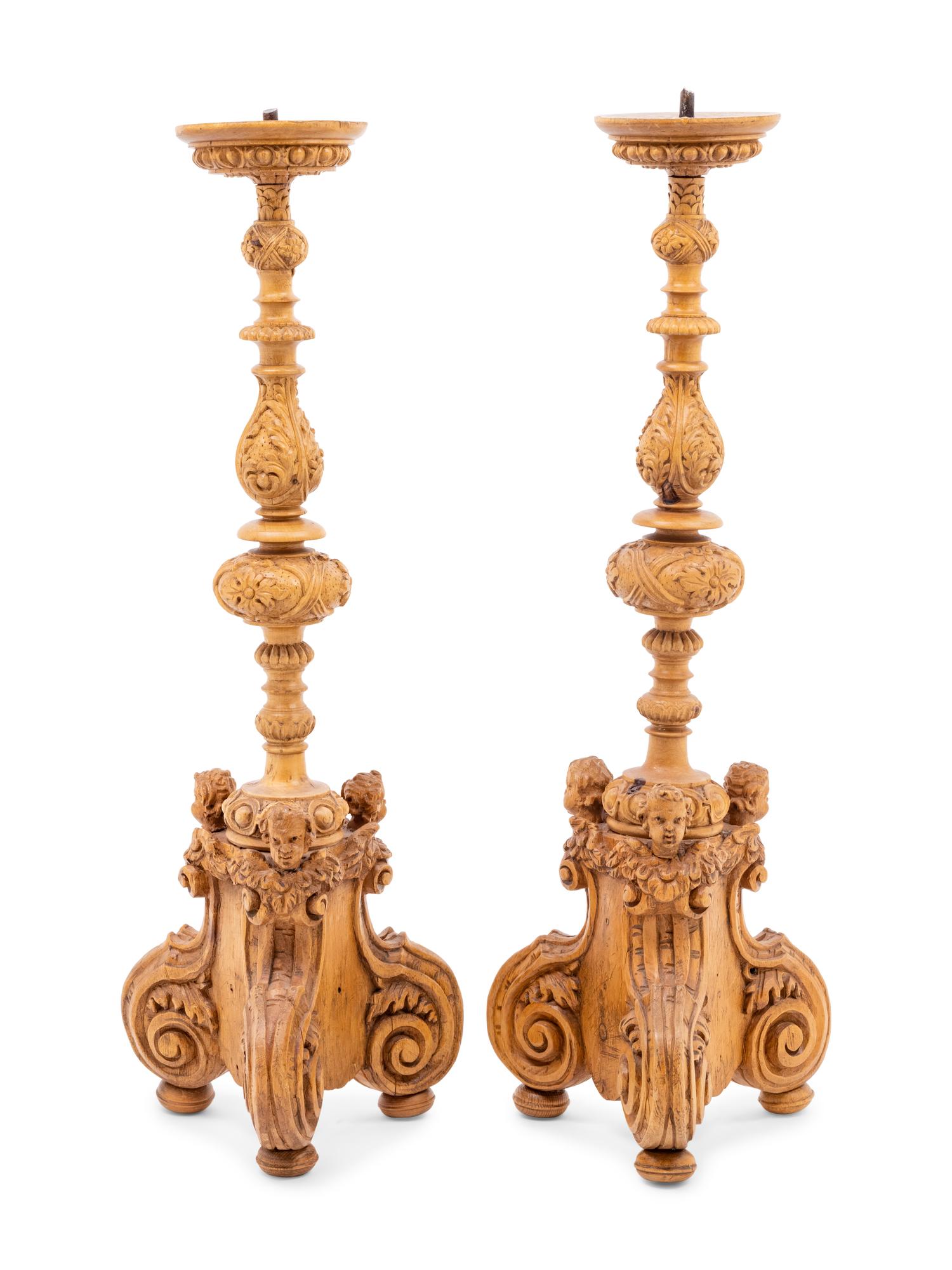 A Pair of Continental Carved Wood Prickets