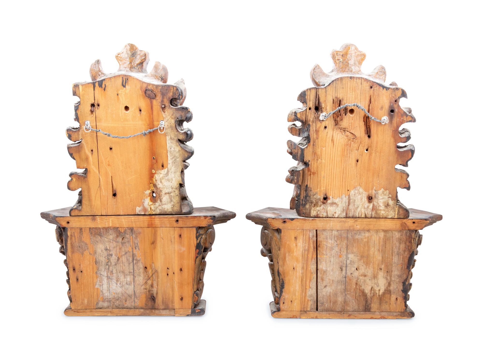 A Pair of Italian Painted and Parcel Gilt Masks