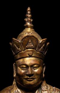 A Tibetan Gilt Bronze Figure of a Seated Guru