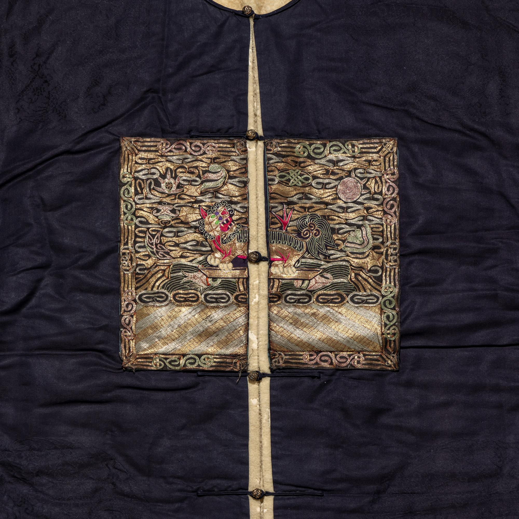 A Chinese Dark Blue Silk Fur Lined Official's Robe, Bufu , Late Qing Dynasty — 清晚期 石青地四品武官冬補服