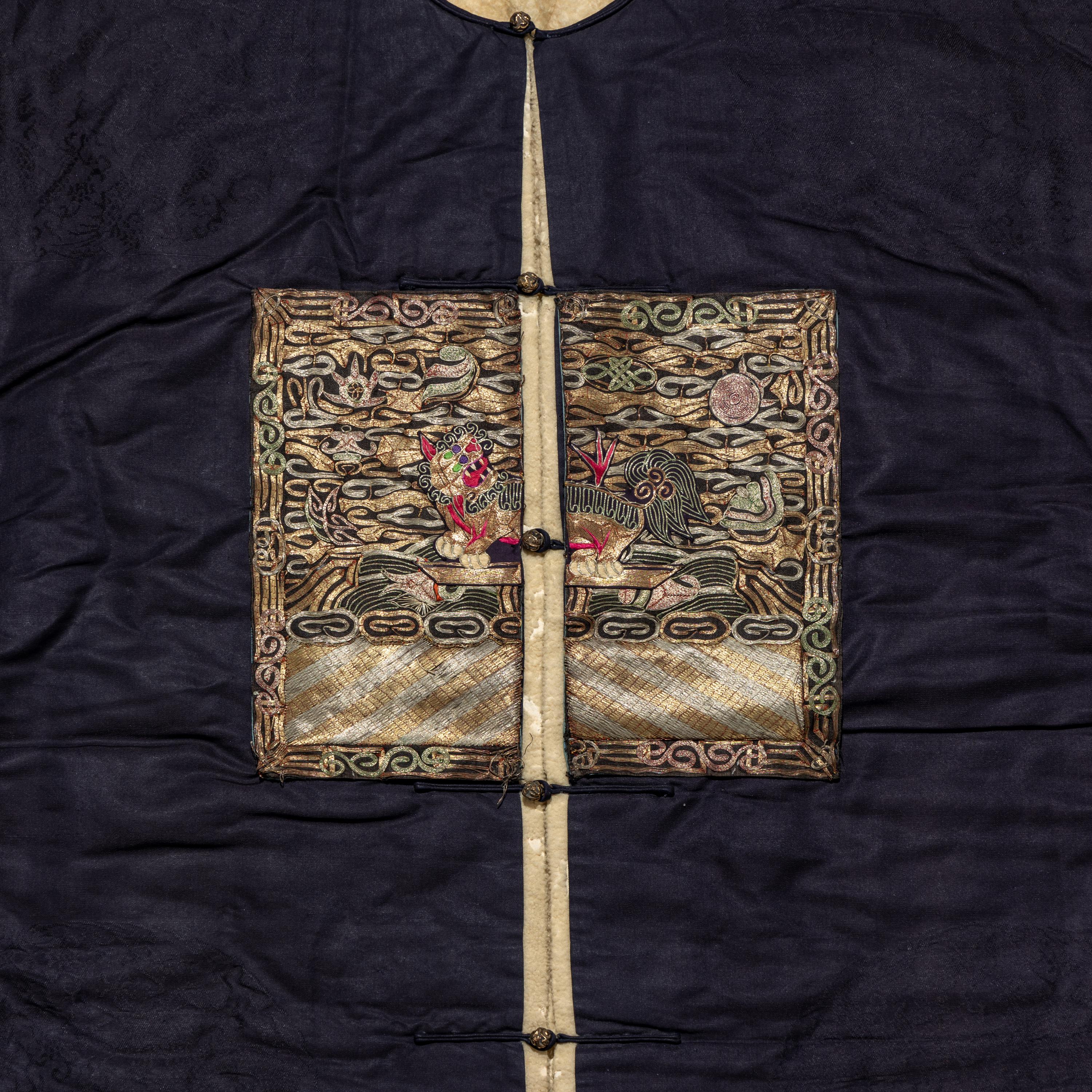 A Chinese Dark Blue Silk Fur Lined Official's Robe, Bufu , Late Qing Dynasty — 清晚期 石青地四品武官冬補服
