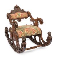 An Italian Carved Walnut Fantasy Rocking Chair