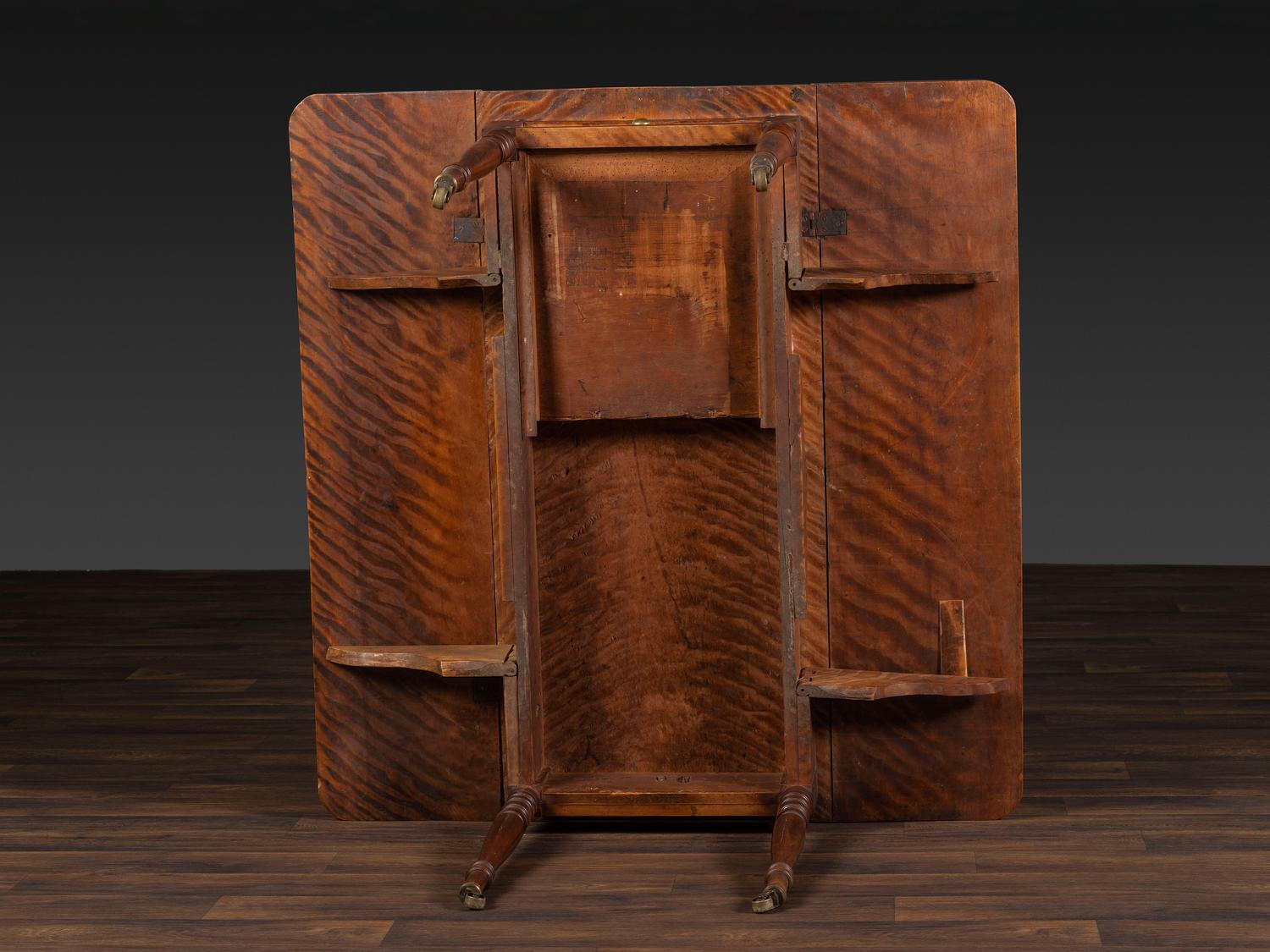 A Late Federal Figured Birch Drop Leaf Dining Table