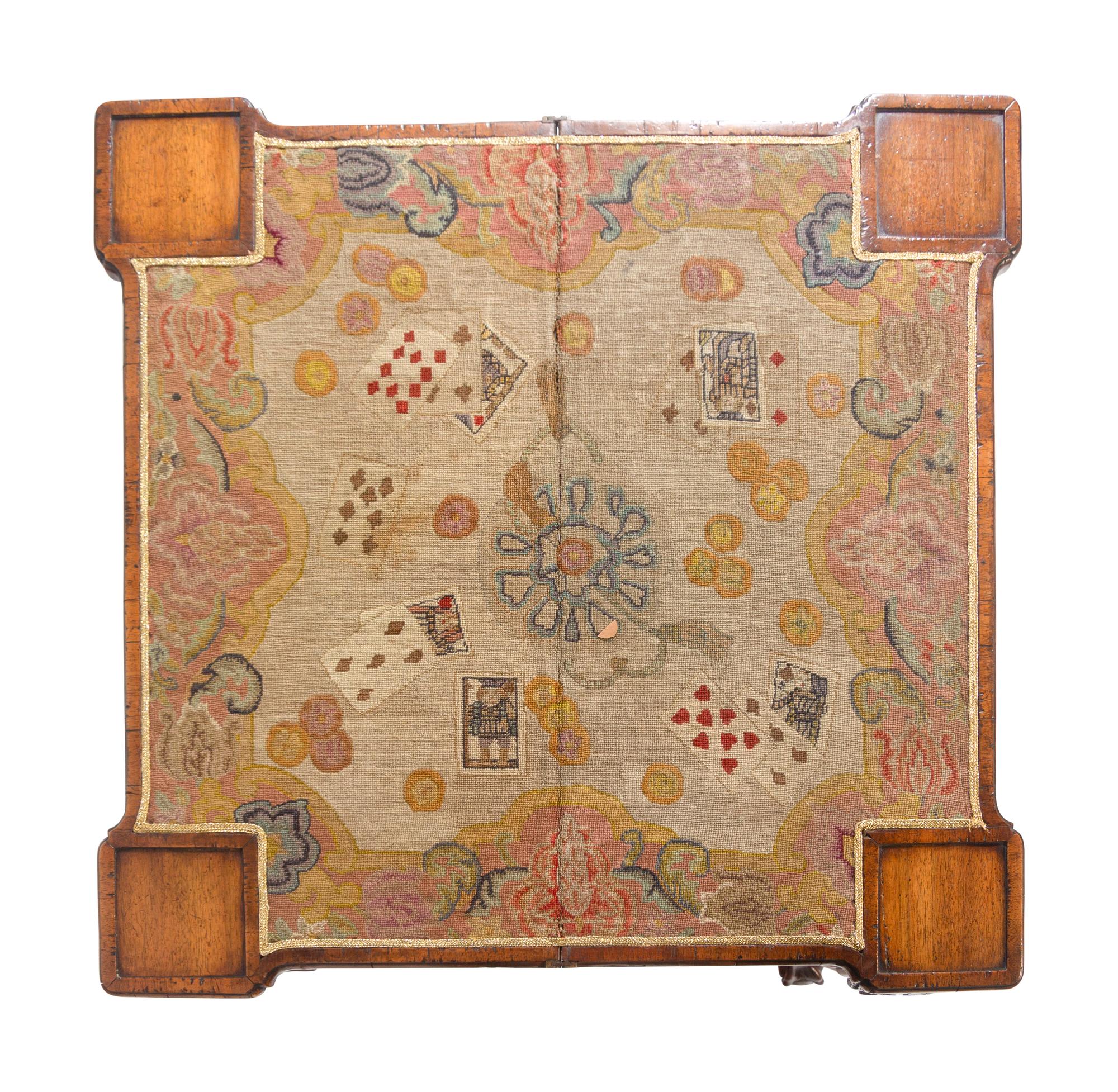 A George II Burlwood and Walnut Needlework Inset Concertina-Action Claw-and-Ball Foot Card Table