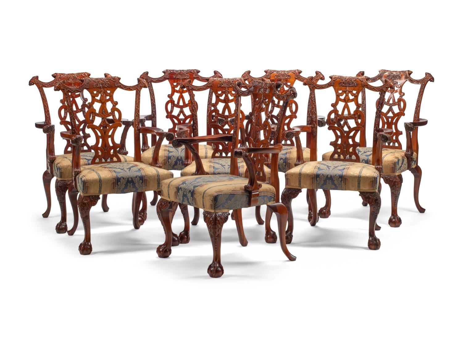 A Set of Eight George III Style Carved Mahogany Dining Chairs