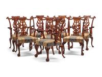 A Set of Eight George III Style Carved Mahogany Dining Chairs