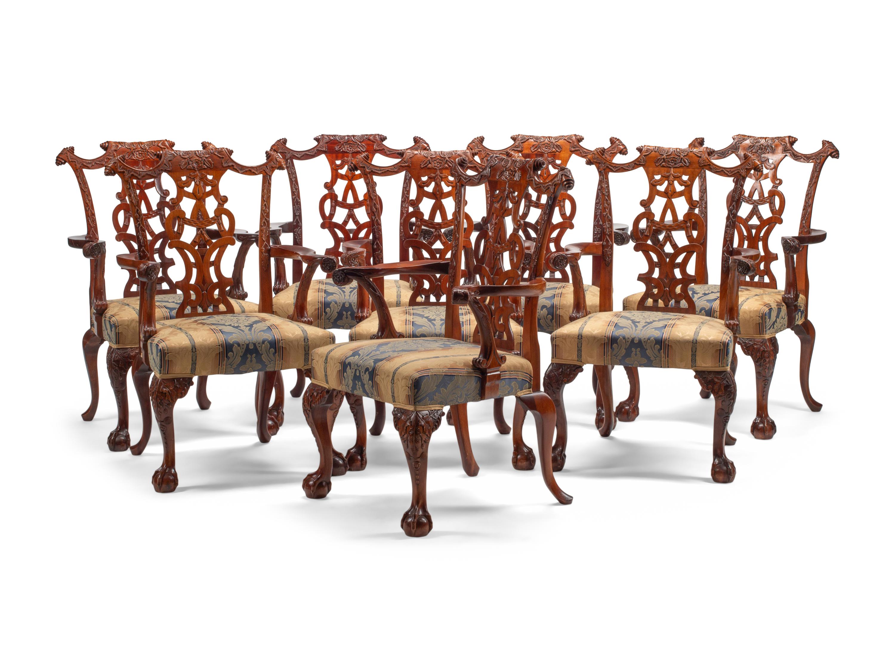 A Set of Eight George III Style Carved Mahogany Dining Chairs