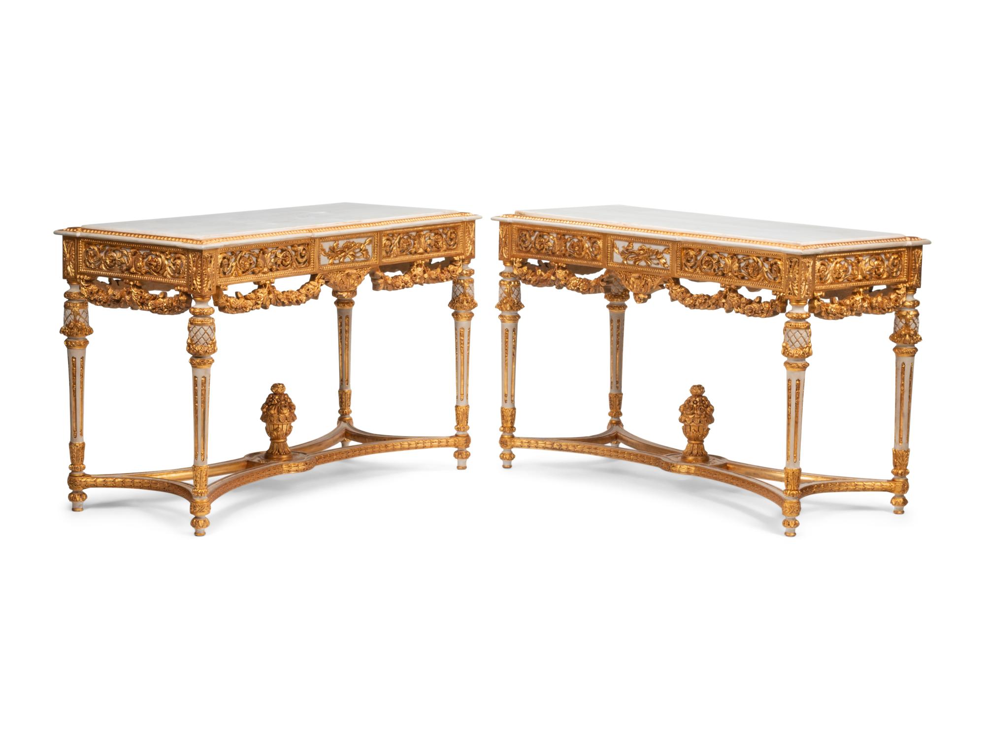 A Pair of Louis XVI Style White Painted and Parcel Gilt Marble-Top Console Tables