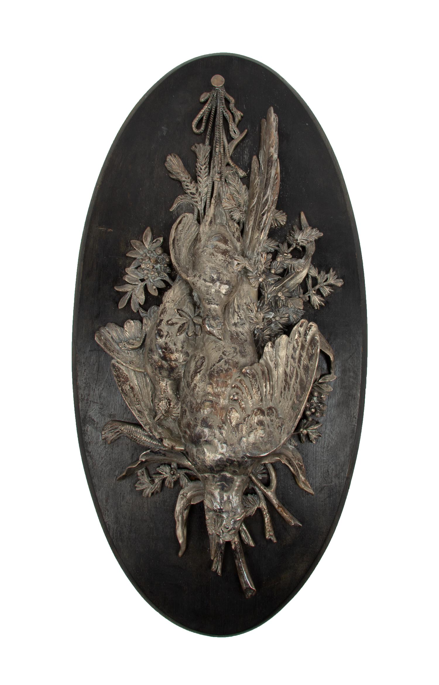 A Silvered Bronze Plaque Depicting a Game Trophy