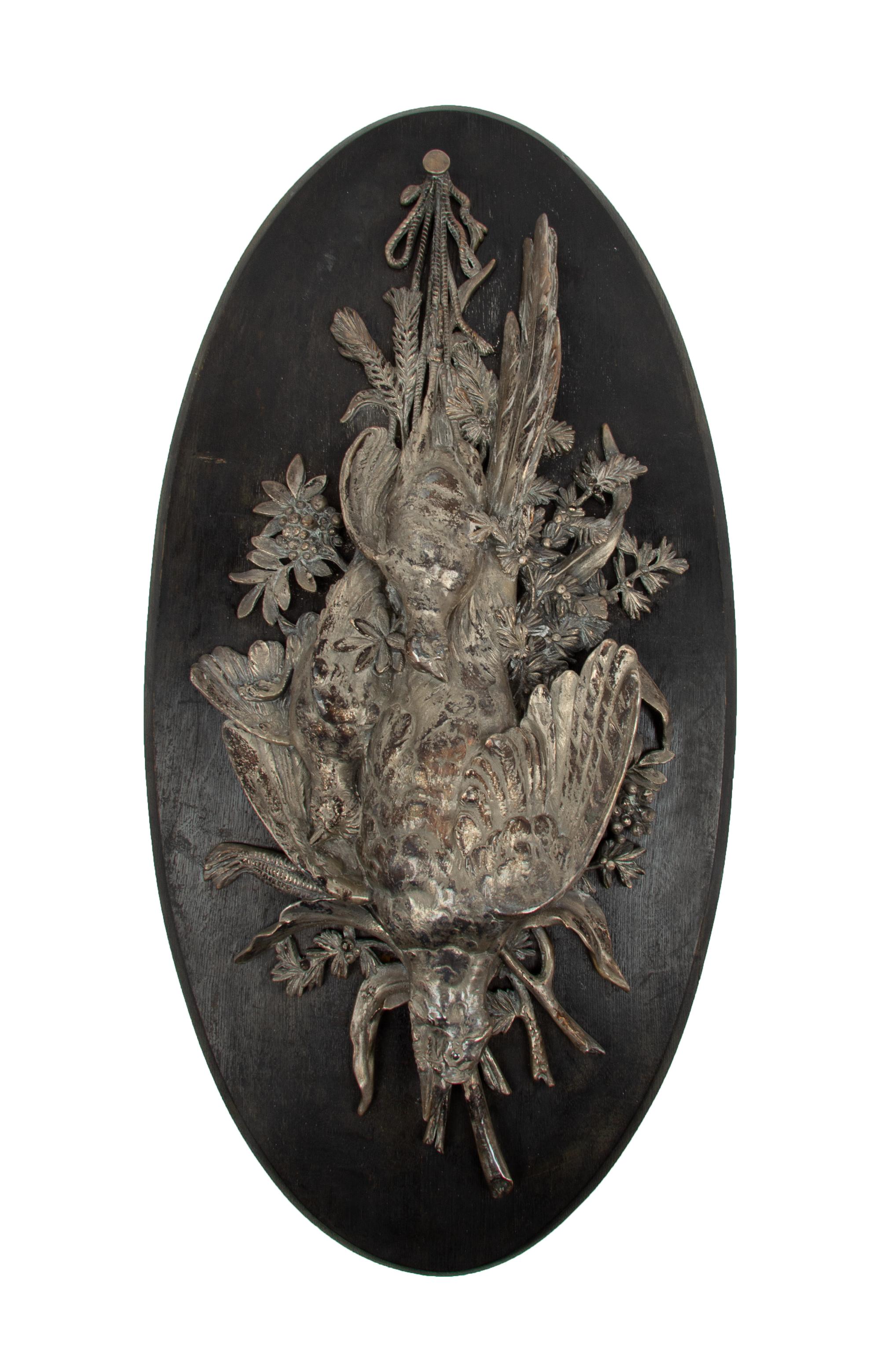 A Silvered Bronze Plaque Depicting a Game Trophy