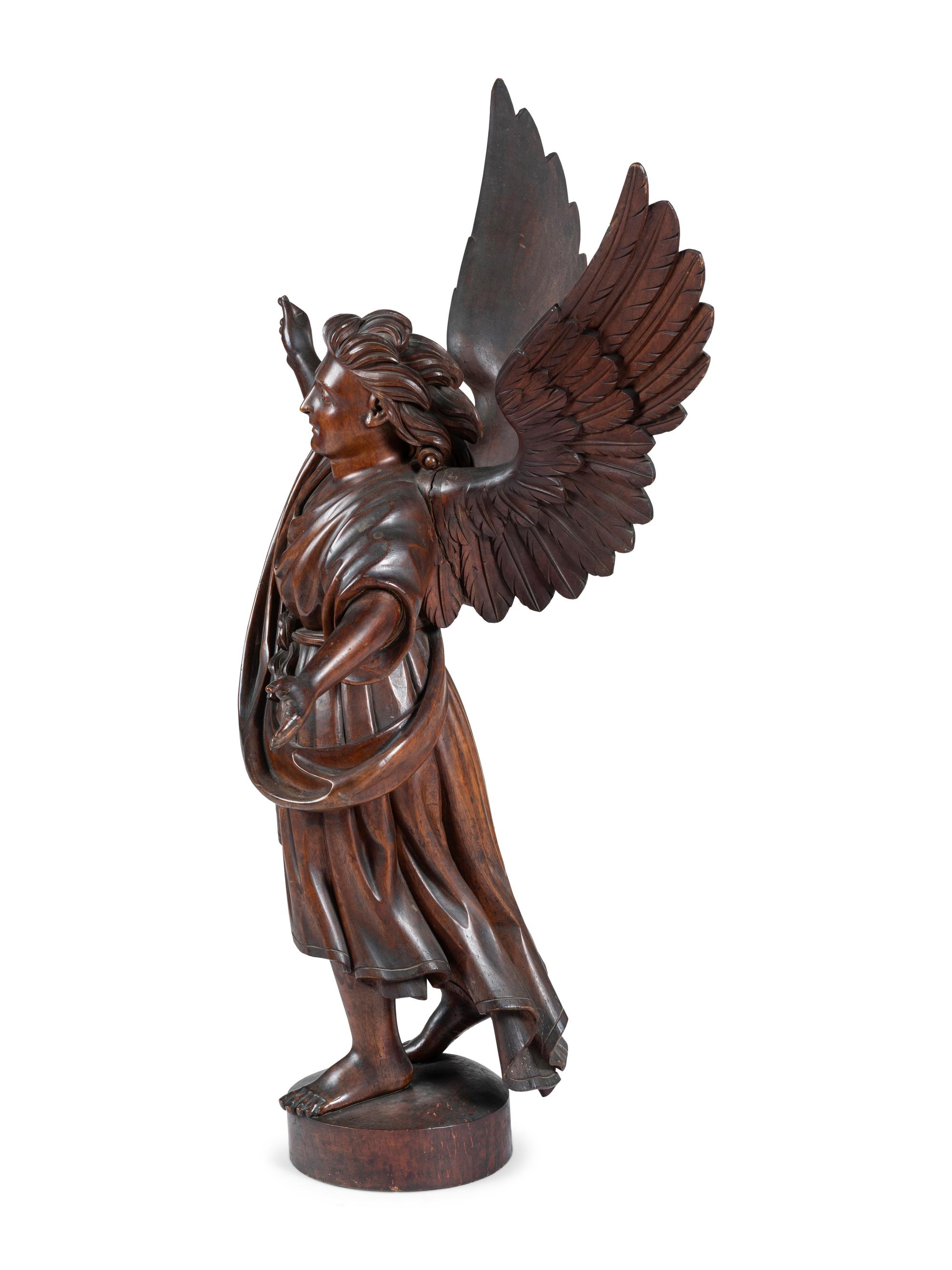 A Carved Walnut Figure of Angel Gabriel
