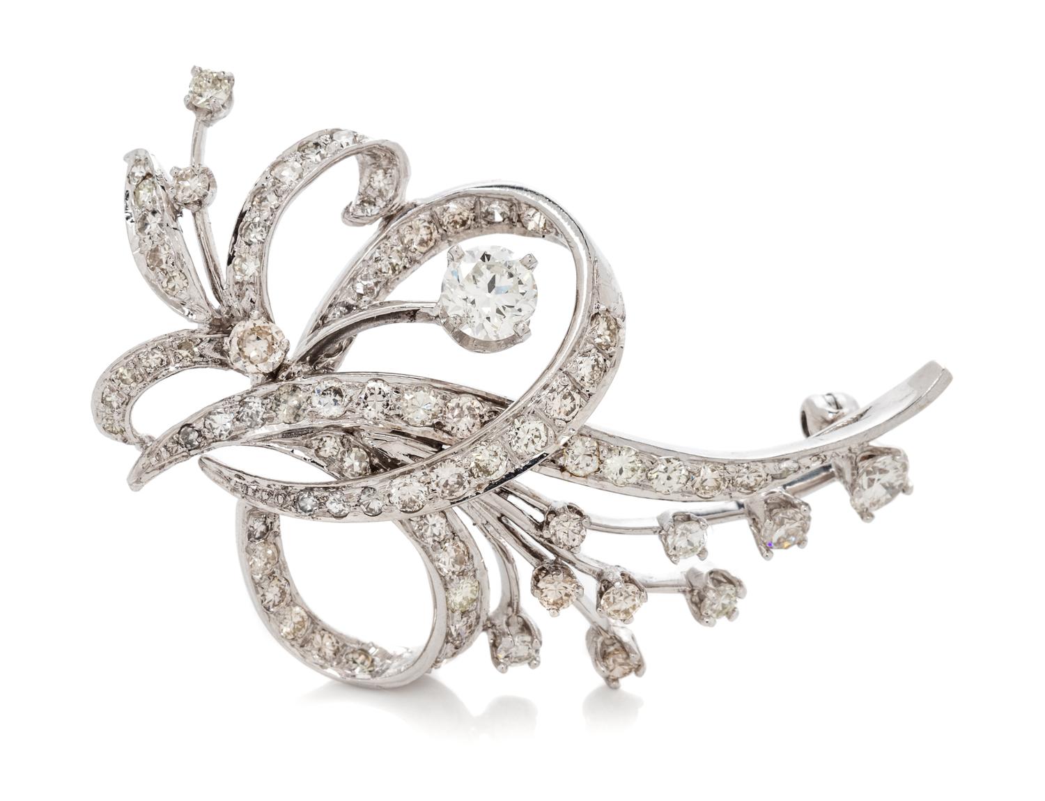 A White Gold and Diamond Spray Brooch, 6.00 dwts.
