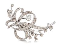 A White Gold and Diamond Spray Brooch, 6.00 dwts.