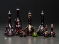 Eight Enameled Amethyst Glass Barber's Items