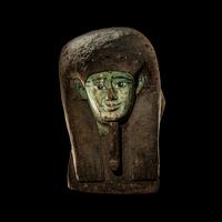 An Egyptian Painted Wood Sarcophagus Head