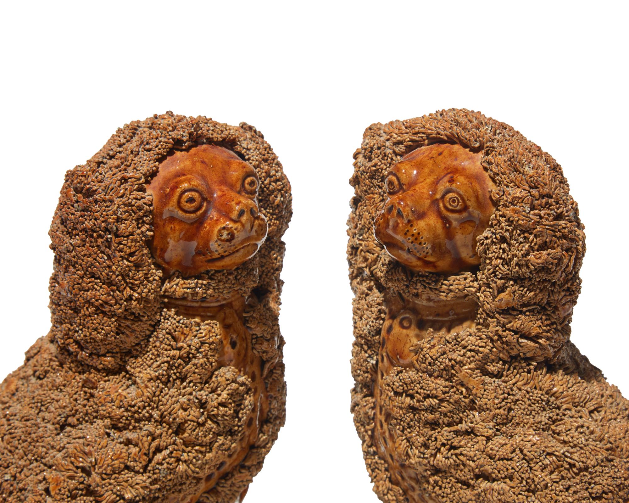A Scarce Pair of Rockingham Glazed Spaniels