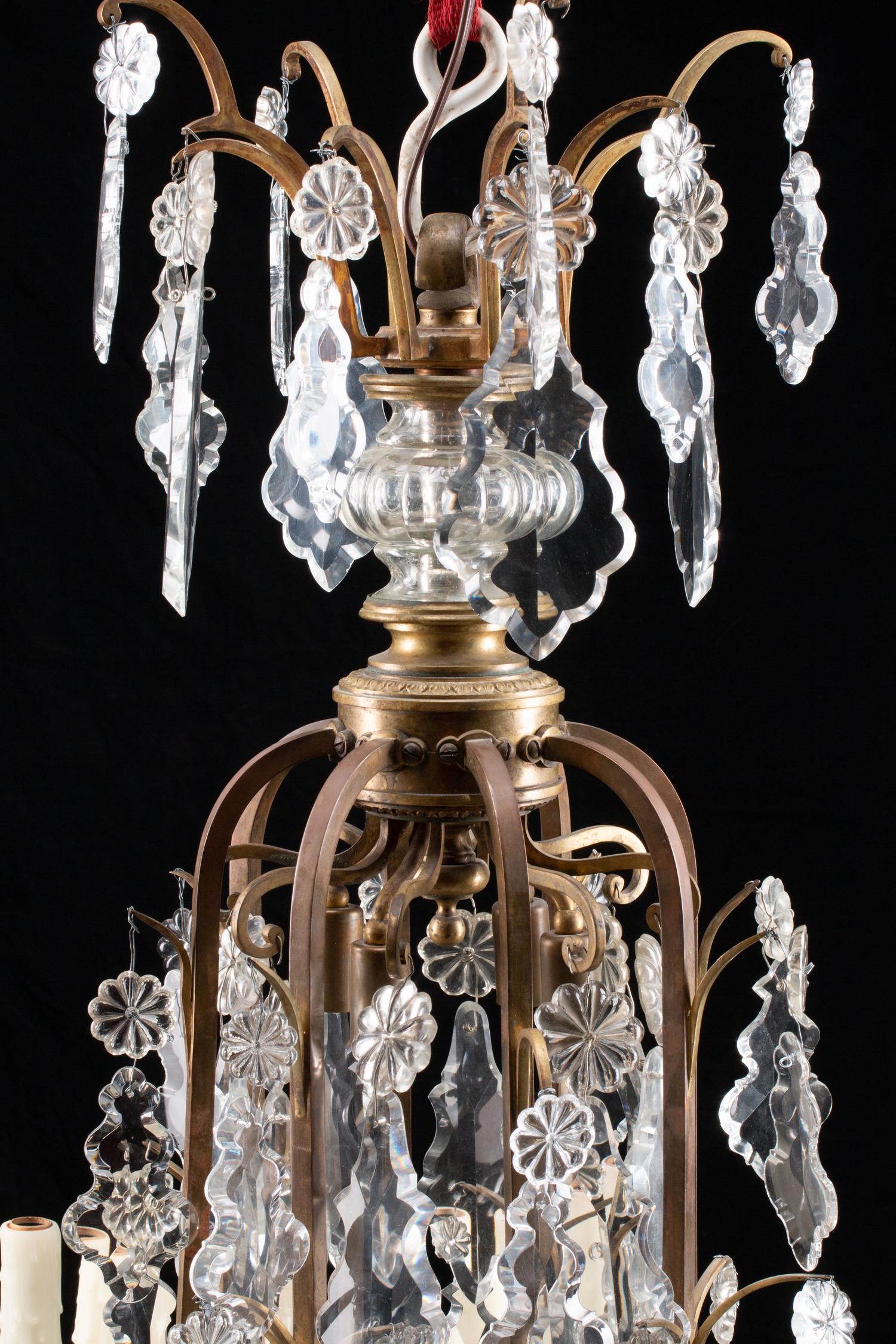A Louis XV Style Bronze and Glass Twelve-Light Chandelier
