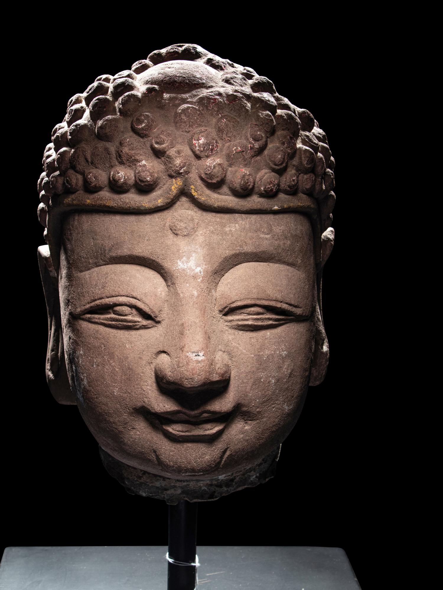 A Pair of Chinese Carved Stone Heads of Buddha