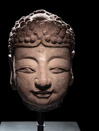A Pair of Chinese Carved Stone Heads of Buddha