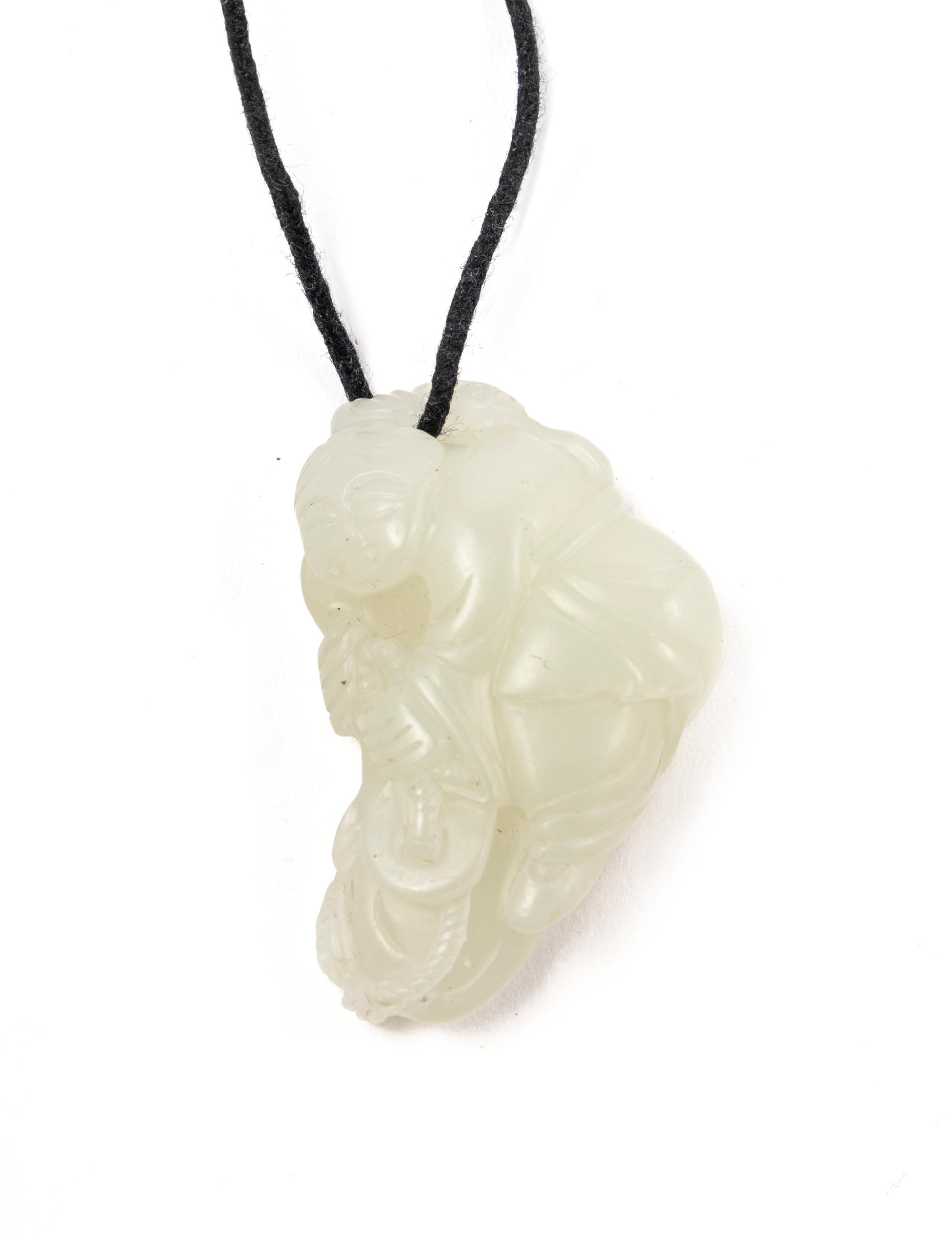 A Chinese Pale Celadon Jade Figure of a Child