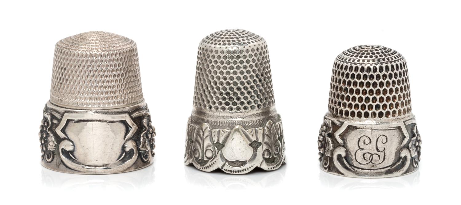 A Pair of American Silver Grapevine Thimbles, Simons Bros., Philadelphia, PA, each having a knurled top and body above a grape cluster