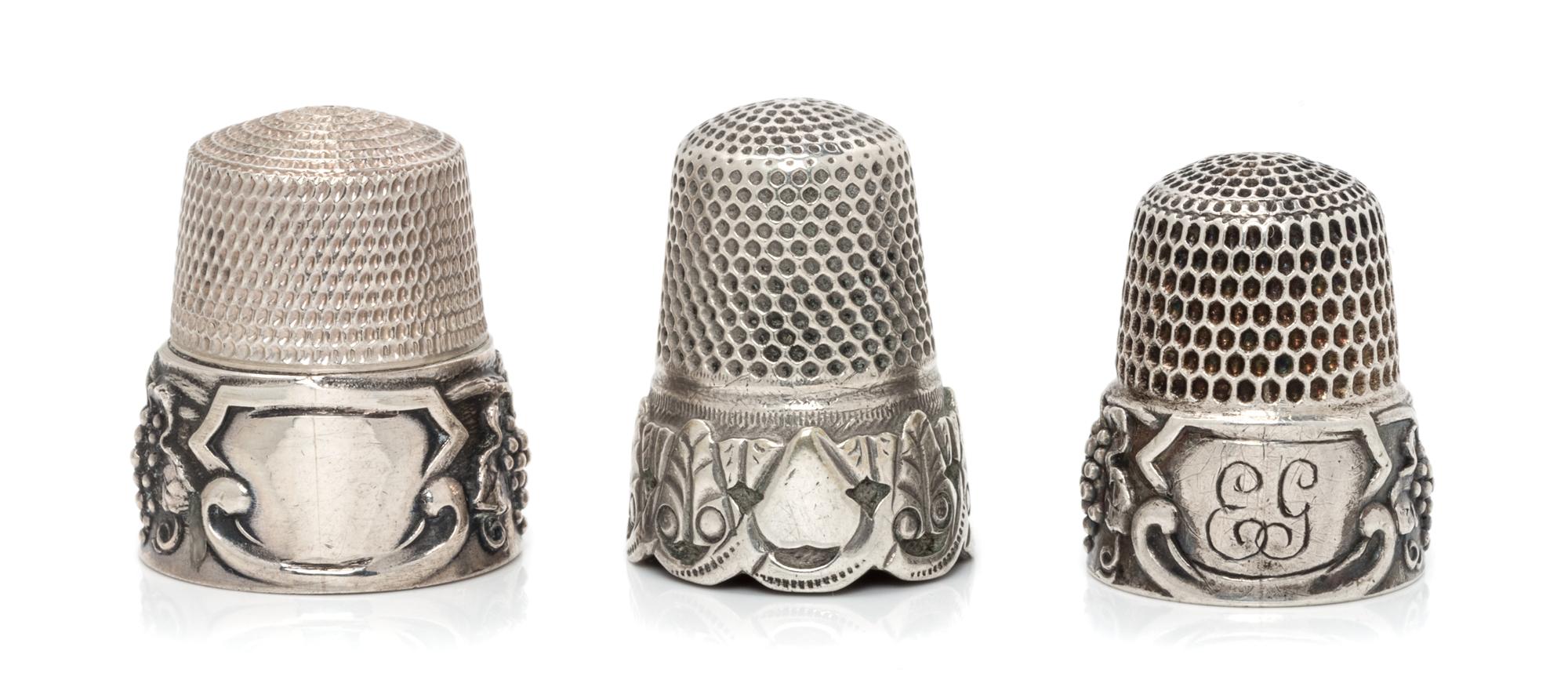 A Pair of American Silver Grapevine Thimbles, Simons Bros., Philadelphia, PA, each having a knurled top and body above a grape cluster