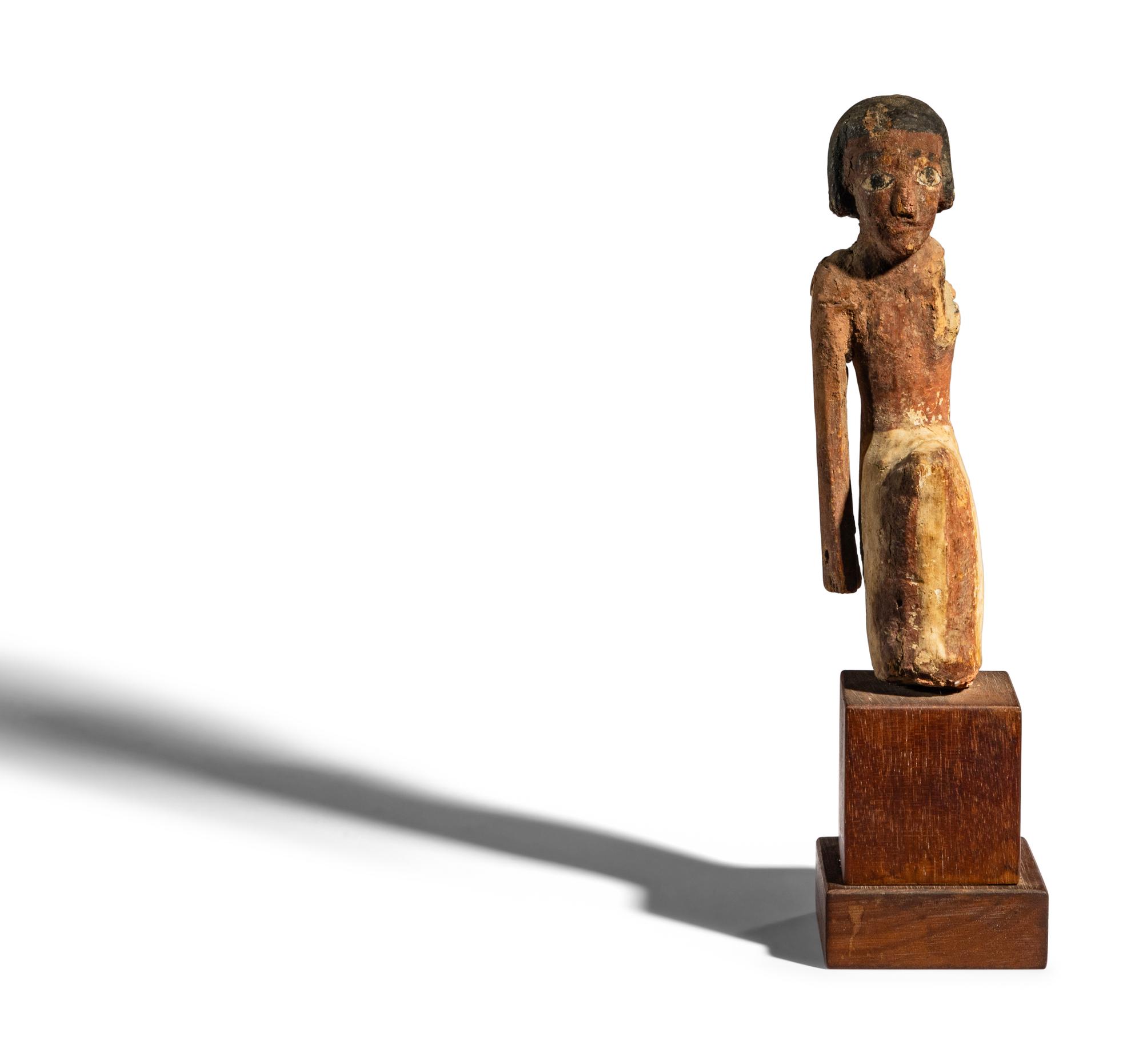 An Egyptian Painted Wood Figure