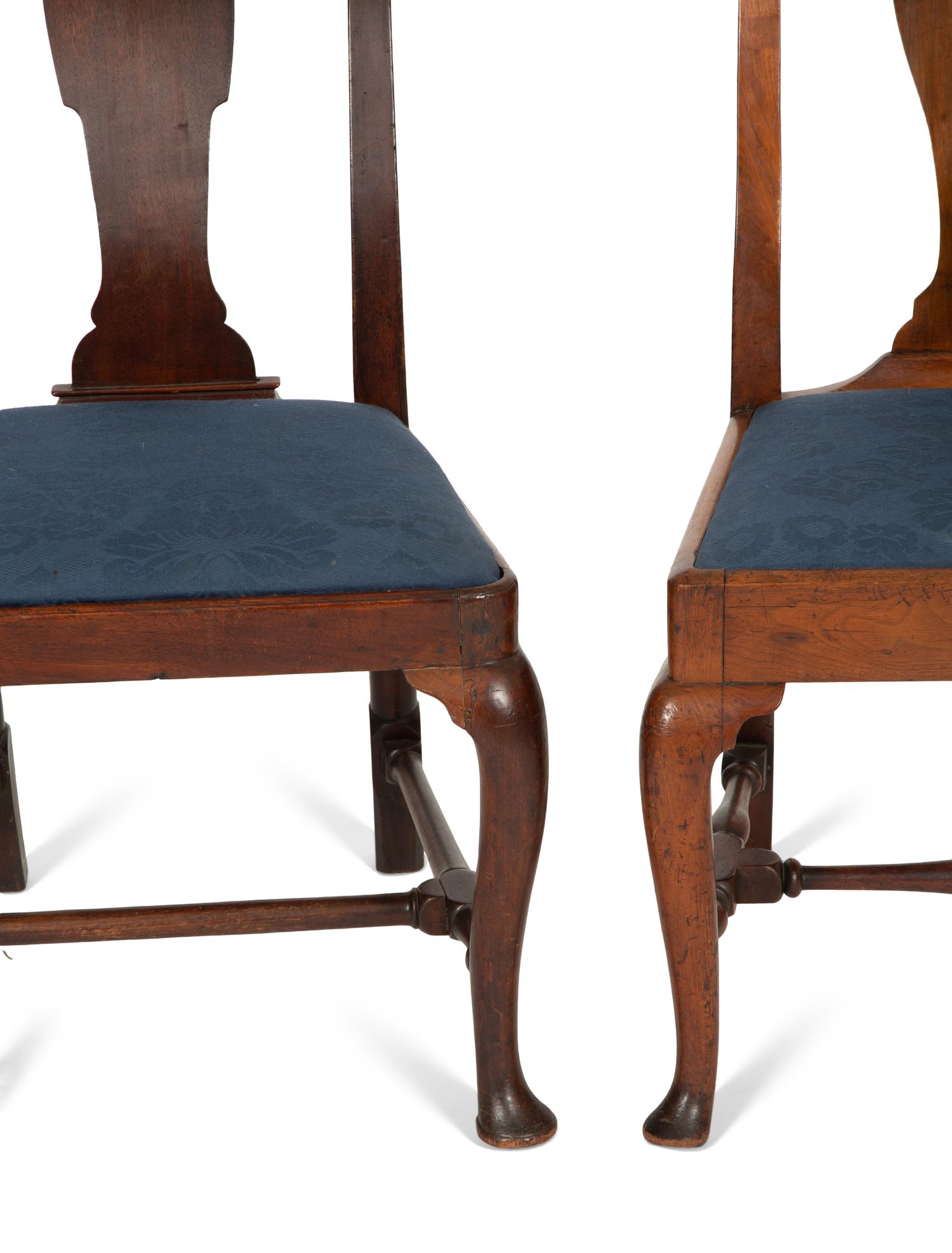 An Assemblage of Five Queen Anne Cherry and Mahogany Dining Chairs