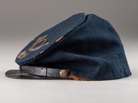 [CIVIL WAR]. Forage cap with contractor label featuring 104th regimental number and insignia.