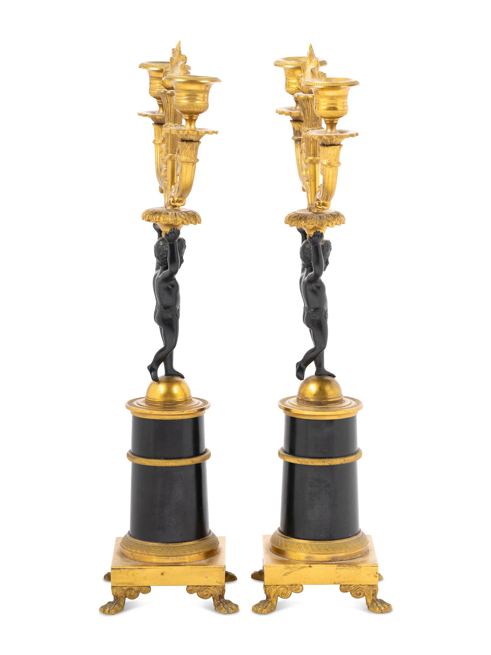 A Pair of Empire Style Parcel Gilt Metal Two-Light Candelabra