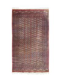 A Pakistani Wool Rug — 20TH CENTURY