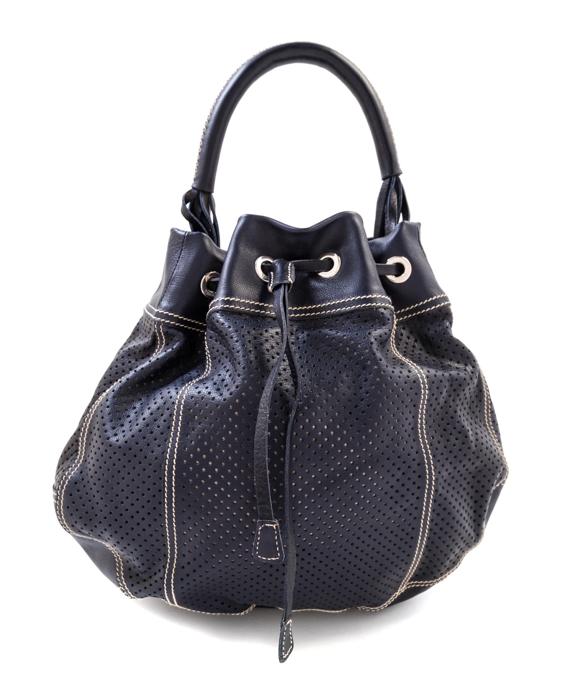 A Prada Navy Perforated Leather Bucket Bag, 13" x 12" x 4"; Handle drop: 4.5".