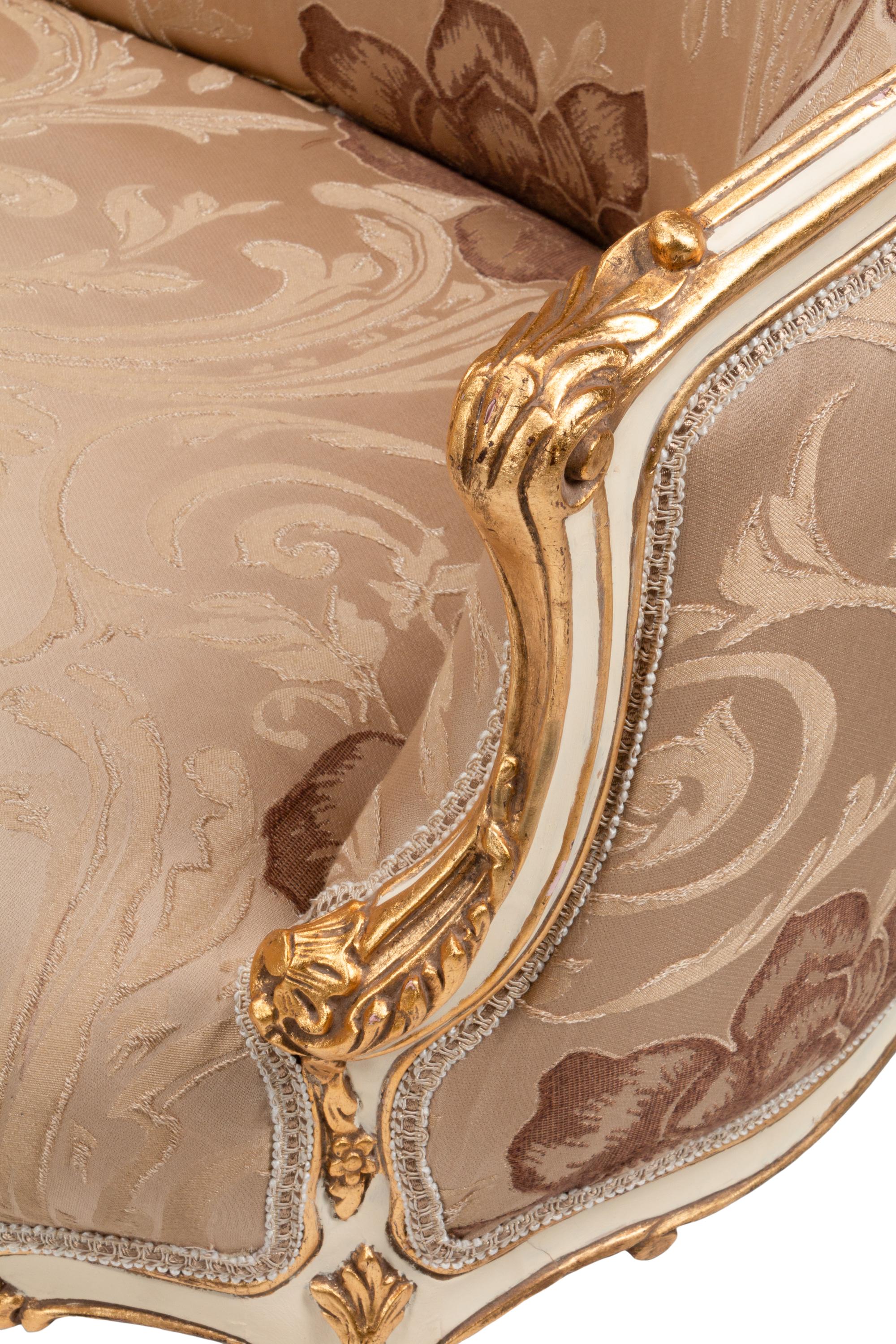 A Pair of Louis XV Style Cream-Painted and Parcel Gilt Settees