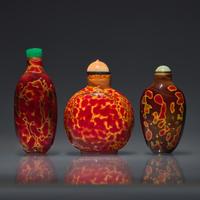 Three Chinese "Realgar" Glass Snuff Bottles, Qing Dynasty, 18th-19th Century — 清中期 雄黃料鼻煙壺三支