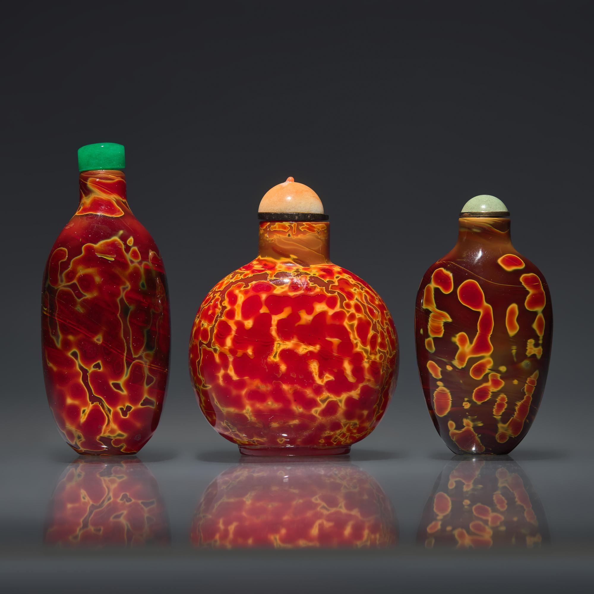 Three Chinese "Realgar" Glass Snuff Bottles, Qing Dynasty, 18th-19th Century — 清中期 雄黃料鼻煙壺三支