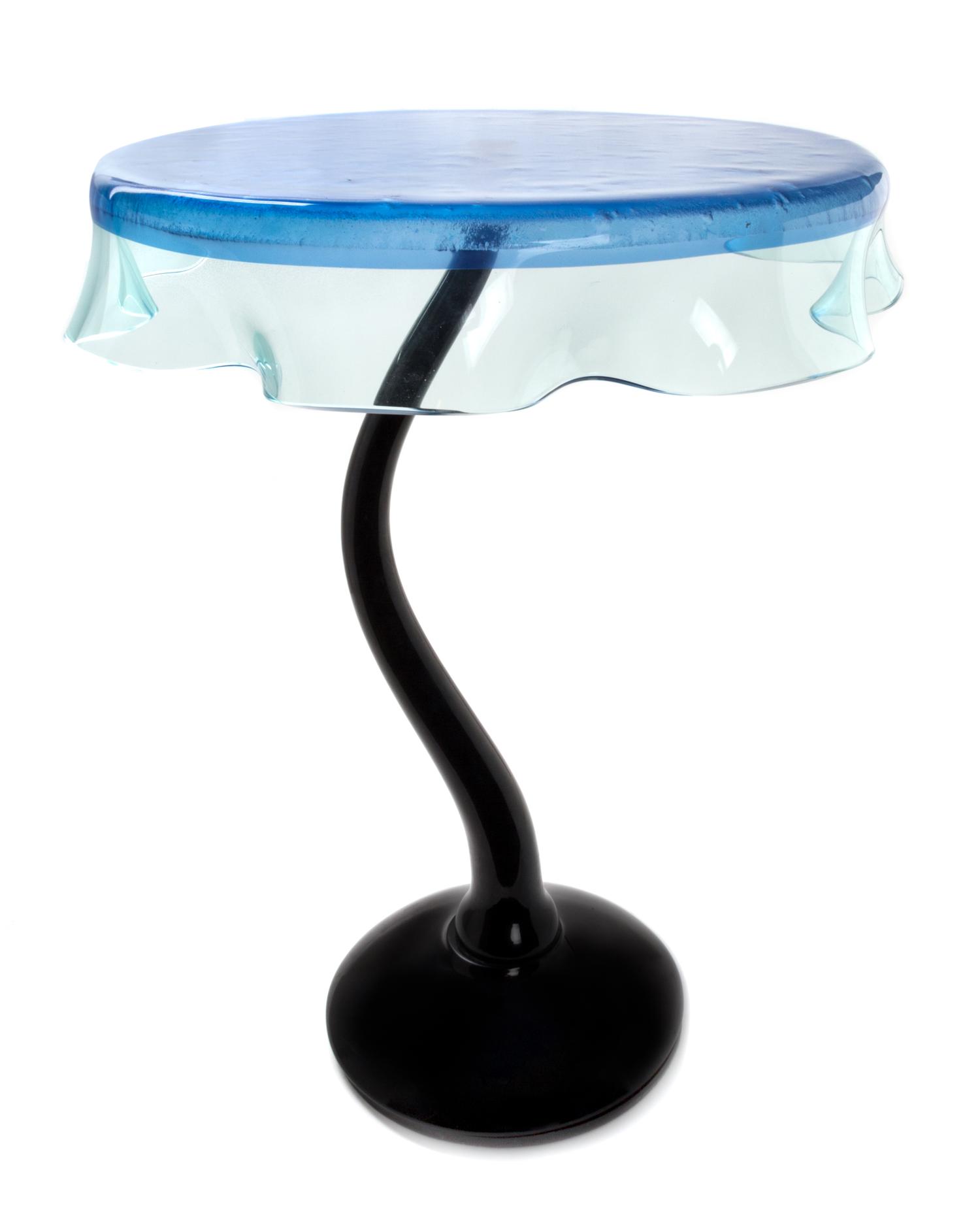 An Italian Glass Side Table Height 28 1/2 x diameter 24 inches.