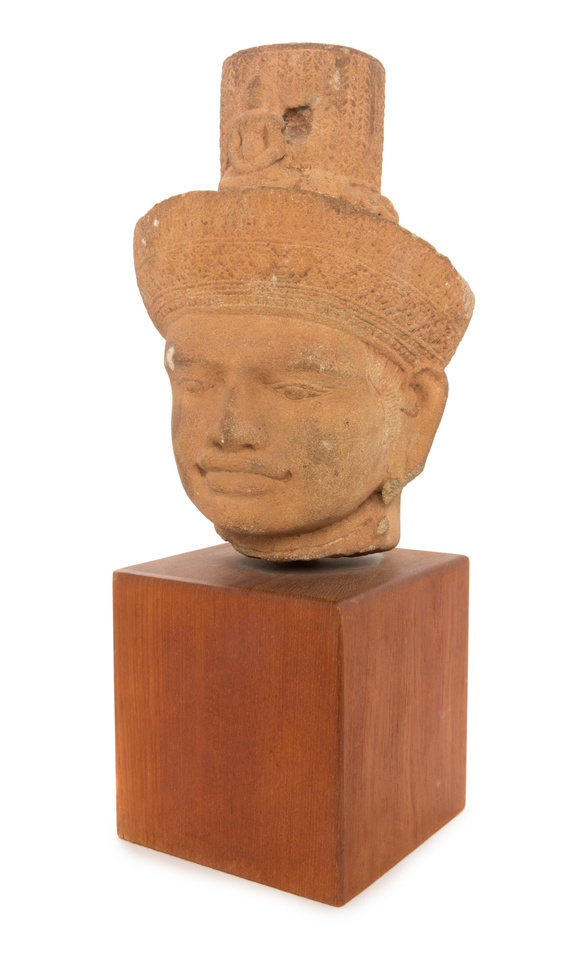 A Khmer Sandstone Head of a Deity Height 11 1/8 inches.