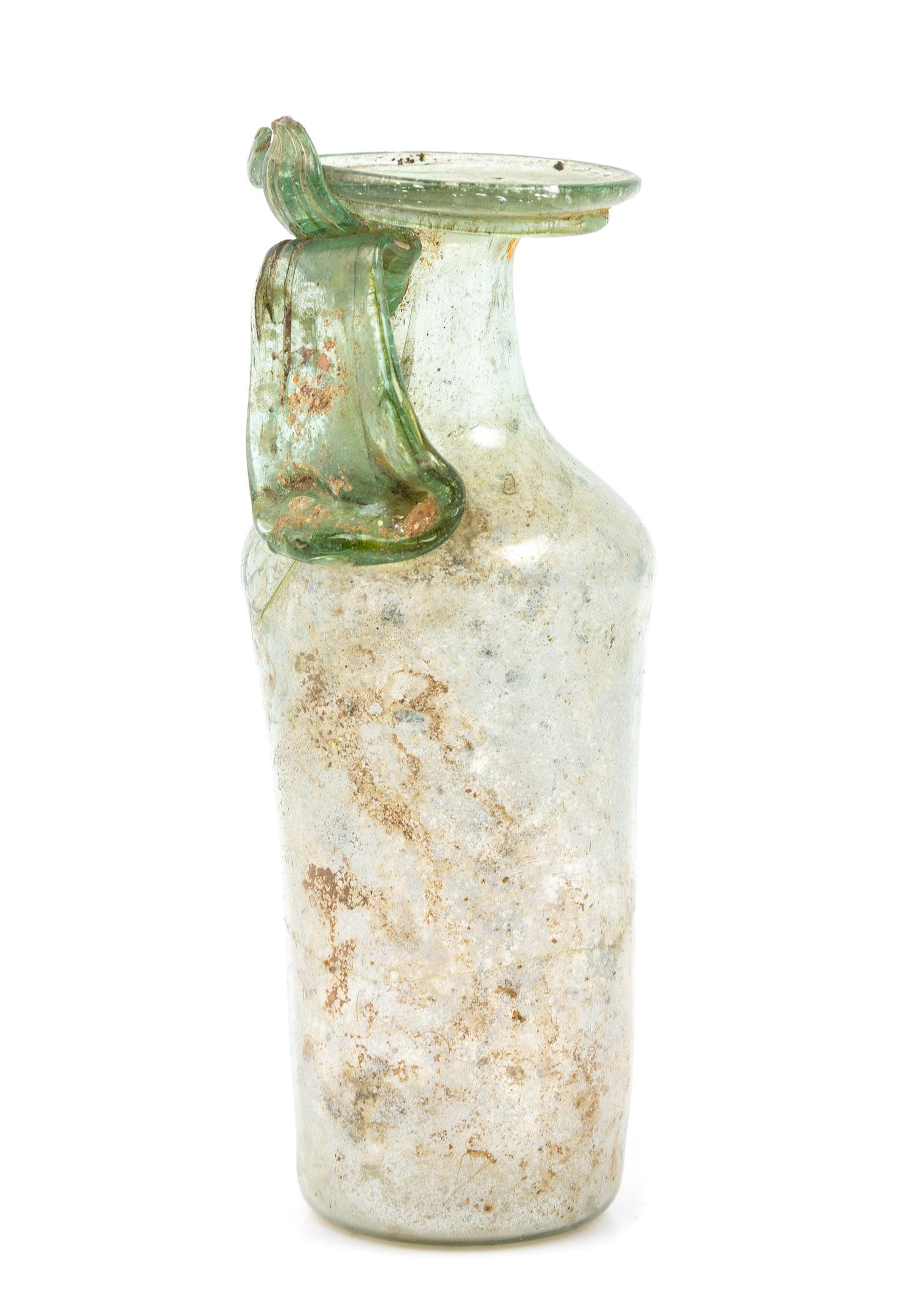 A Roman Glass Unguentarium Height 5 1/2 inches. — CIRCA 1ST-2ND CENTURY C.E.