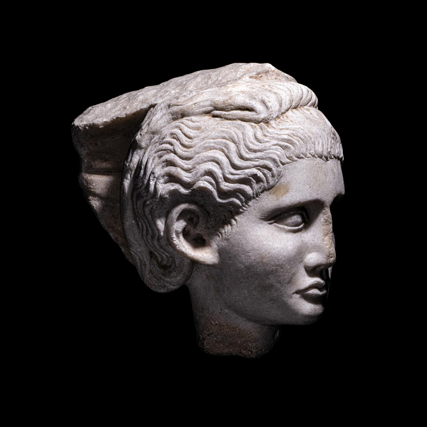 A Roman Marble Relief with a Female Head