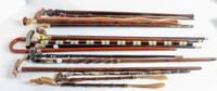 A Collection of Carved Wood and Gilt-Metal Topped Walking Canes Height of tallest 38 inches.