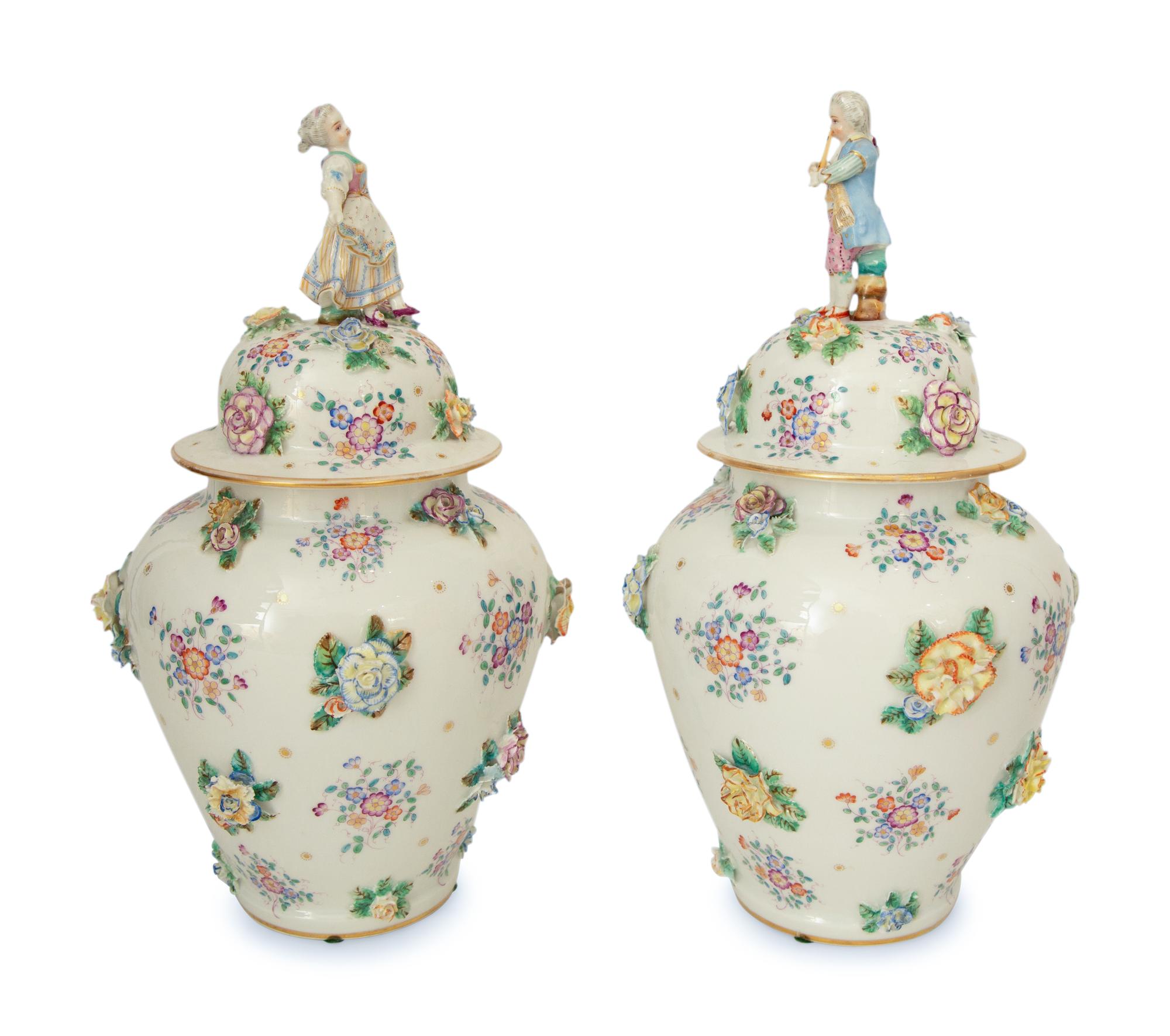 A Pair of Meissen Porcelain Covered Jars with Figural Finials