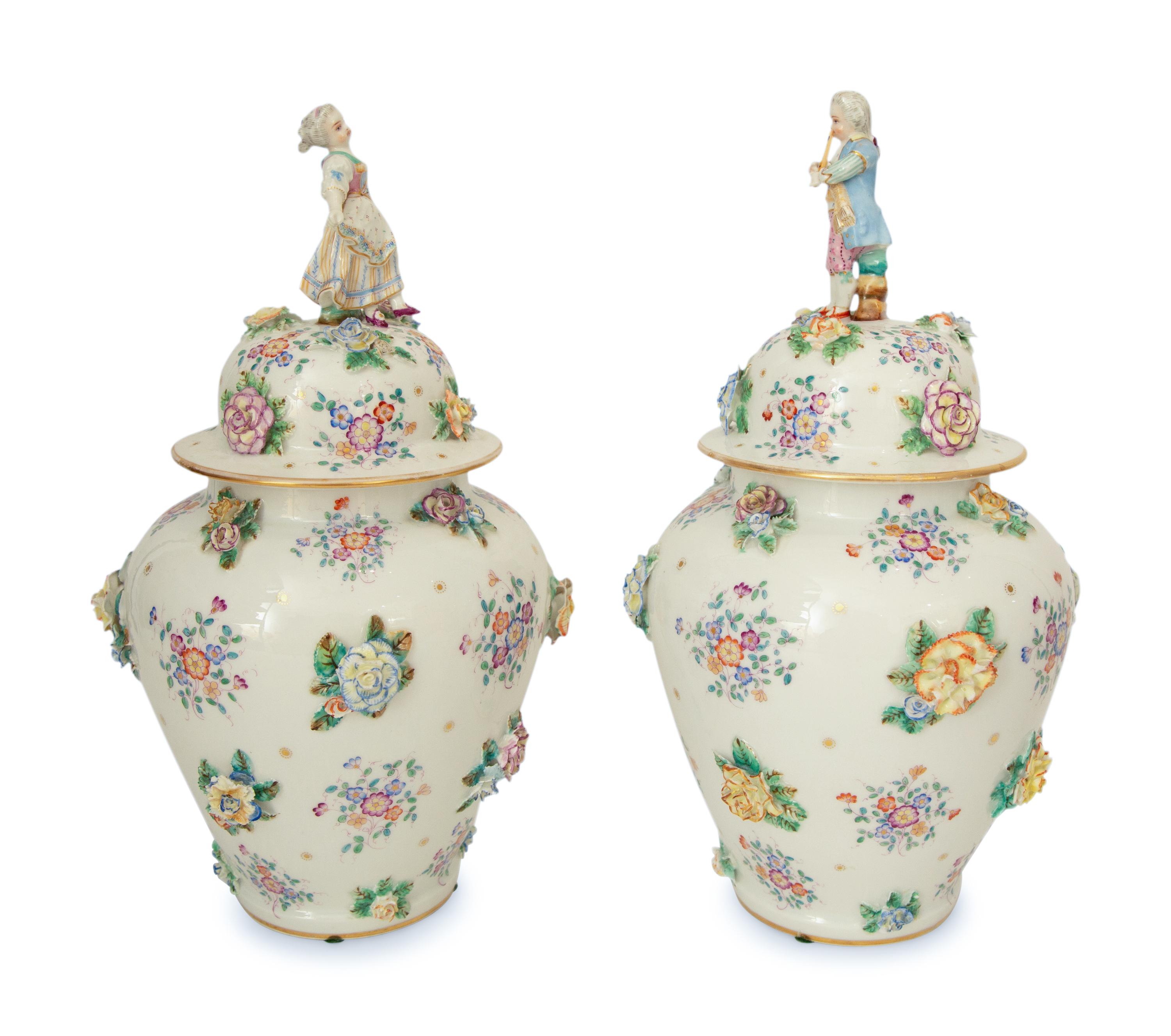 A Pair of Meissen Porcelain Covered Jars with Figural Finials