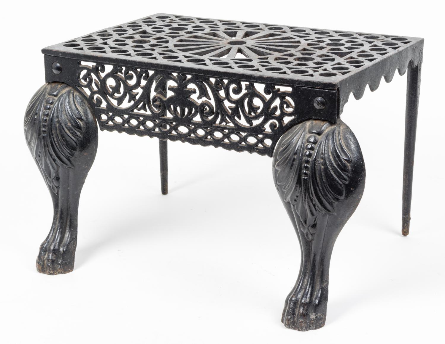 A Cast Iron Footman or Fireplace Bench Height 12 inches.