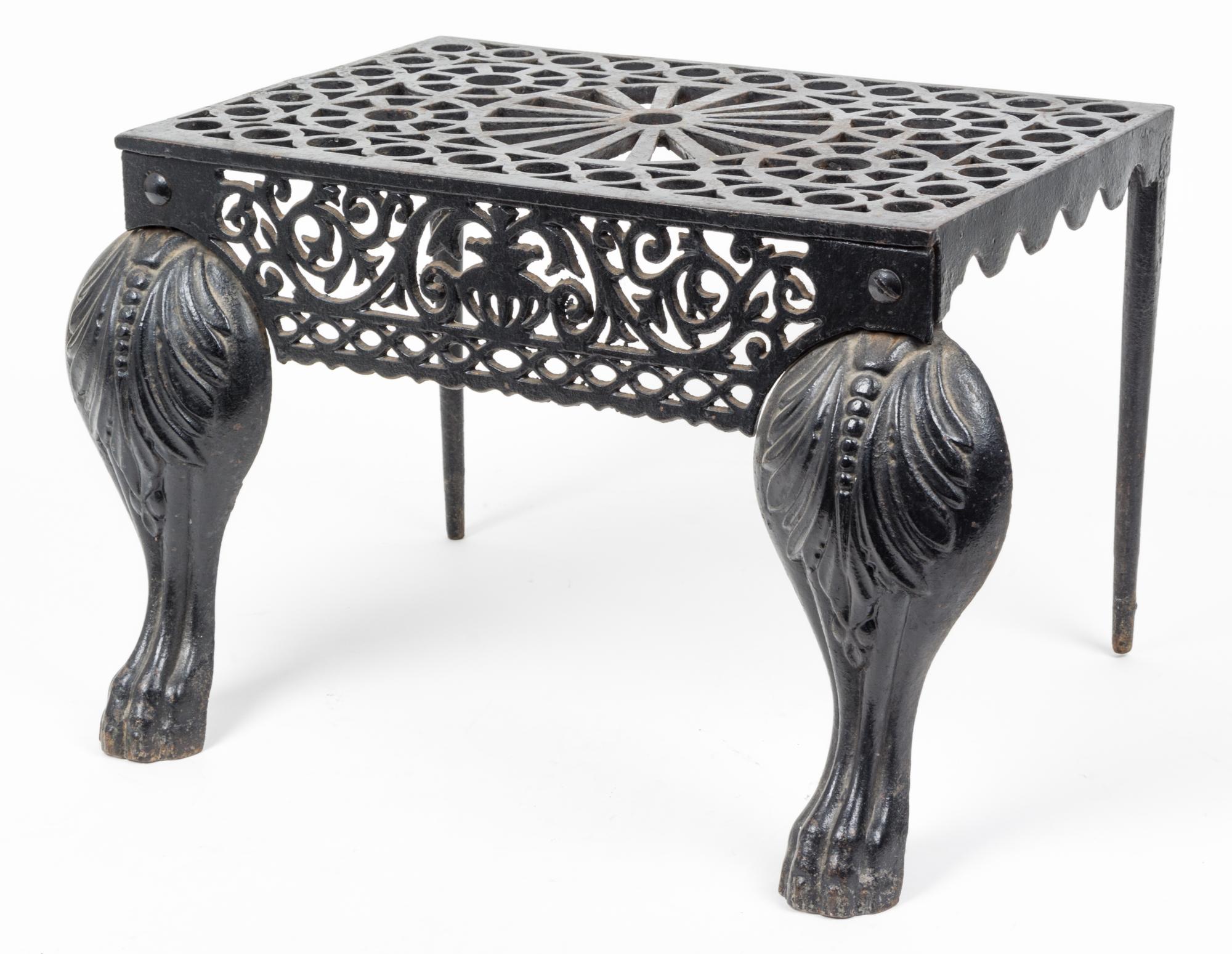 A Cast Iron Footman or Fireplace Bench Height 12 inches.