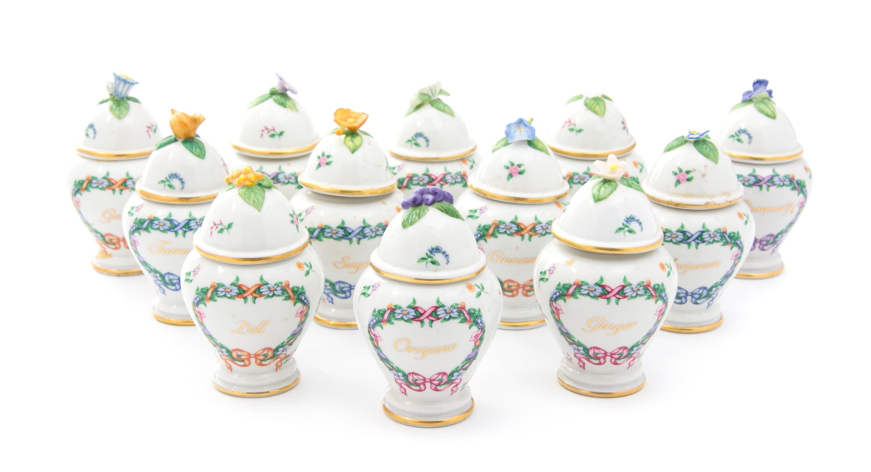 A Set of Twelve Franklin Mint Porcelain Spice Jars Height 4 inches
